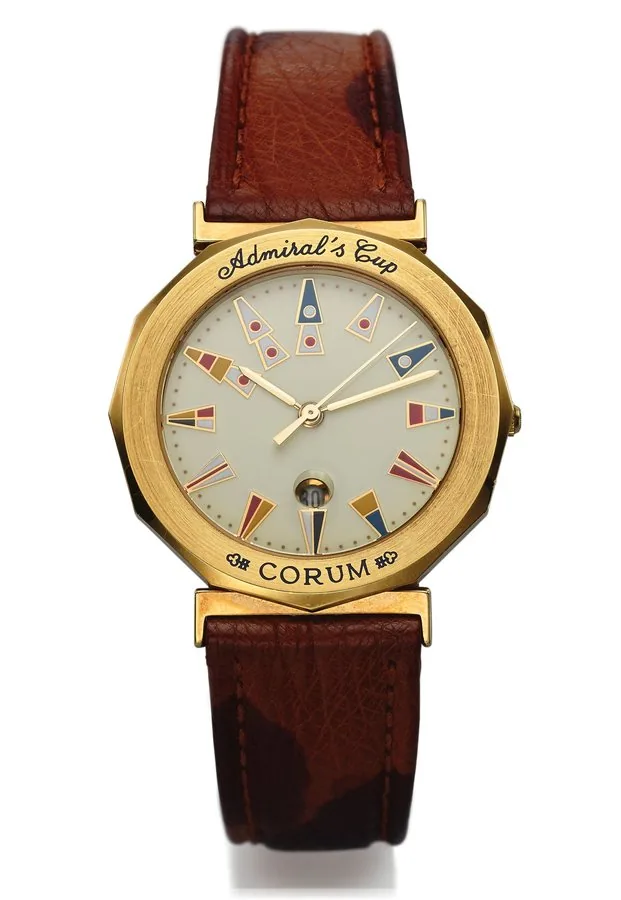 CORUM REF. 39.830.56 ADMIRAL'S CUP QUARTZ YELLOW GOLD Corum "Admiral's Cup," case No. 488919, Ref. 39.830.56. Made in circa 2000. Very fine, center-seconds, water-resistant, dodecagonal, 18K yellow gold quartz wristwatch with date and a stainless steel and gold Corum double deployant clasp.