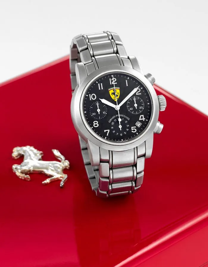 Girard-Perregaux Ref. 8020 "Ferrari" Girard-Perregaux, "Ferrari," No. 1920, Ref. 8020. Made especially for Ferrari in 2002. Fine, self-winding, water-resistant, stainless steel wristwatch with round button chronograph, registers, date and a stainless steel Girard-Perregaux link bracelet with double deployant clasp. Accompanied by the original fitted box, guarantee (now void) and instruction booklet. To be sold without reserve