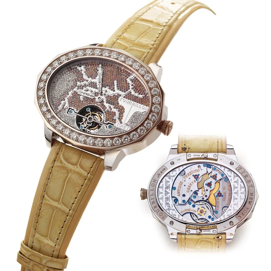 TIRET DEVELOPED BY ANTOINE PREZIUSO TOURBILLON WHITE GOLD Teret, New York, "Day & Night Tourbillon", Made in a limited edition of 12 unique pieces circa 2006. Very rare and unique, horizontal oval, water- resistant, 18K white gold diamond wristwatch with visible one-minute tourbillon regulator.