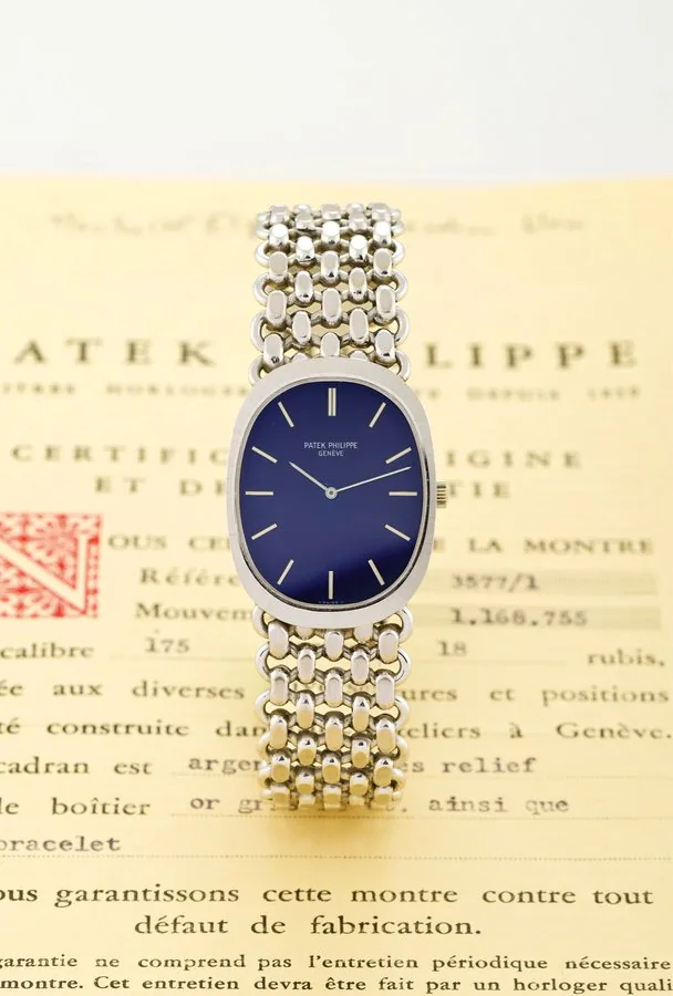 PATEK PHILIPPE REF 3577, GOLDEN ELLIPSE, ORIGINAL CERTIFICATE Patek Philippe, Genève, "Ellipse", No. 1168755, Ref. 3577-1. Made in the 1970s. Very fine, oval, 18K white gold gentleman's wristwatch with an integrated 18K white gold Patek Philippe articulated link bracelet. Accompanied by the original certificate of origin.