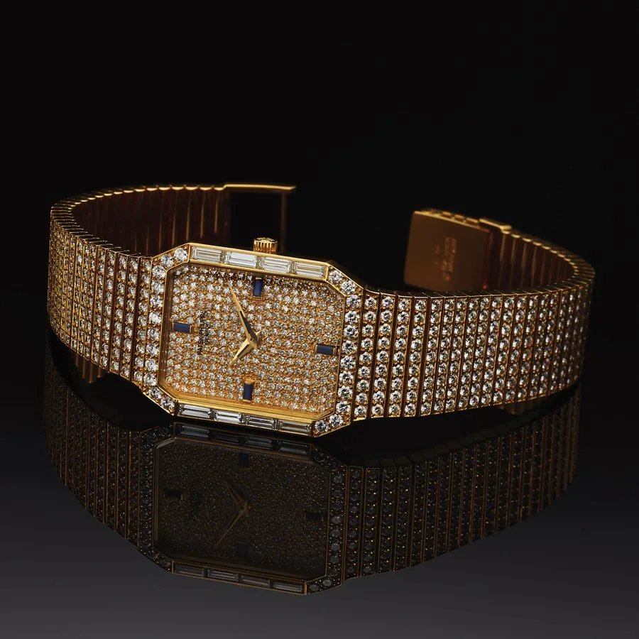 PATEK PHILIPPE REF. 3765 FULL DIAMOND AND YELLOW GOLD Patek Philippe, Genève, No. 1367621, case No. 2801960, Ref. 3765/1. Made in the 1990s. Very fine and rare, hexagonal, 18K yellow gold and diamond wristwatch with an integral 18K yellow gold and full diamond link bracelet (set with 563 round diamonds). Accompanied by booklets.