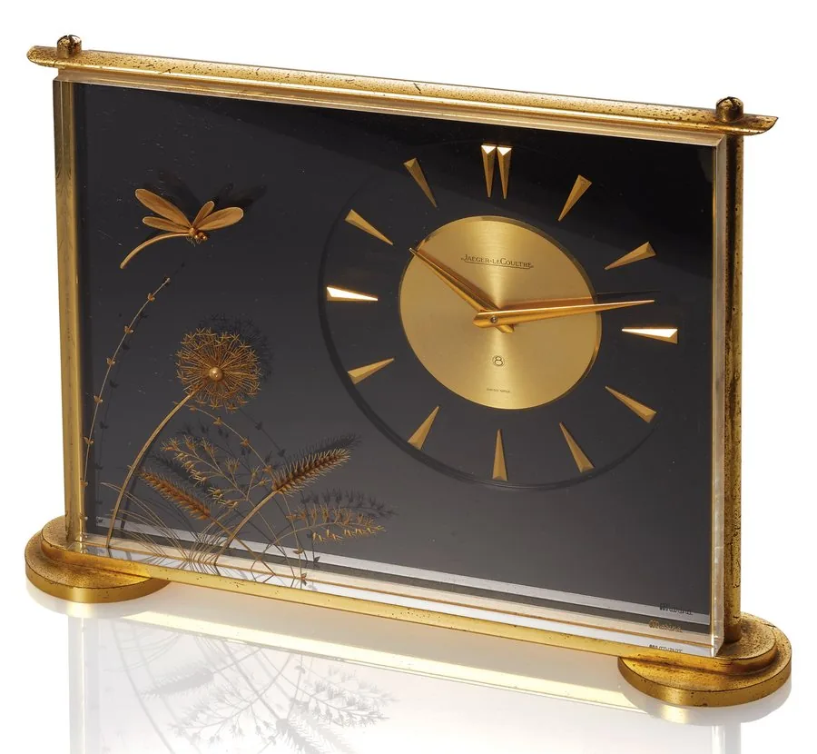 JAEGER-LECOULTRE REF 486 DRAGONFLY CLOCK Jaeger-LeCoultre, Swiss, Ref. 486, Made circa 1960. Fine and rare, brass and Lucite, 8-day going desk clock. Case and dial signed.