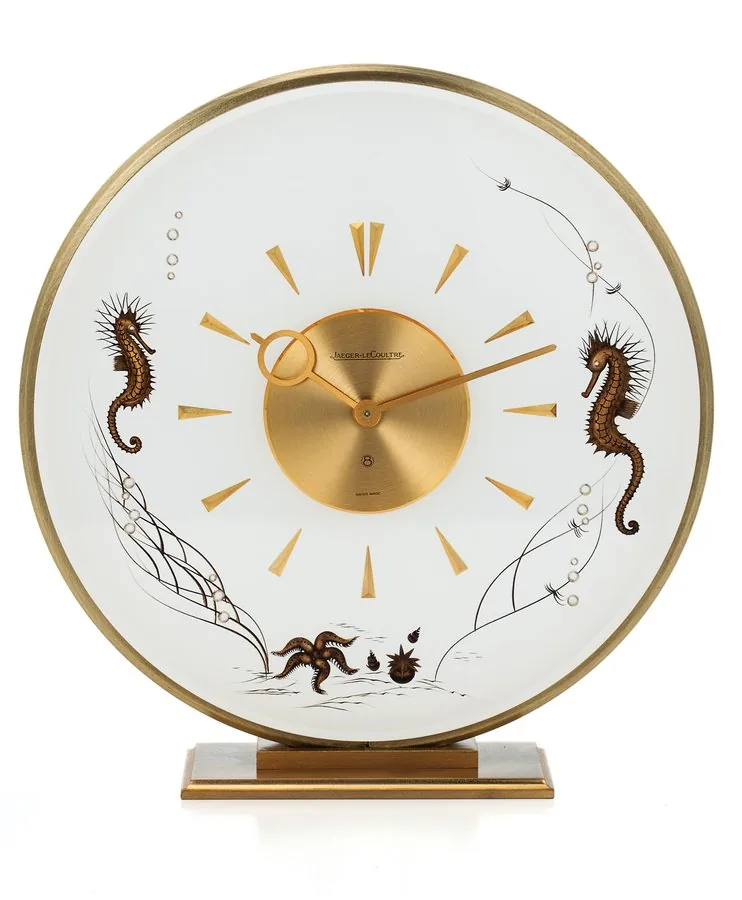JAEGER-LECOULTRE REF. 407 TABLE CLOCK GILT BRASS Jaeger-LeCoultre, No. 407. Made in the 1970s. Fine, gilt brass and plexglass 8-day going table clock.