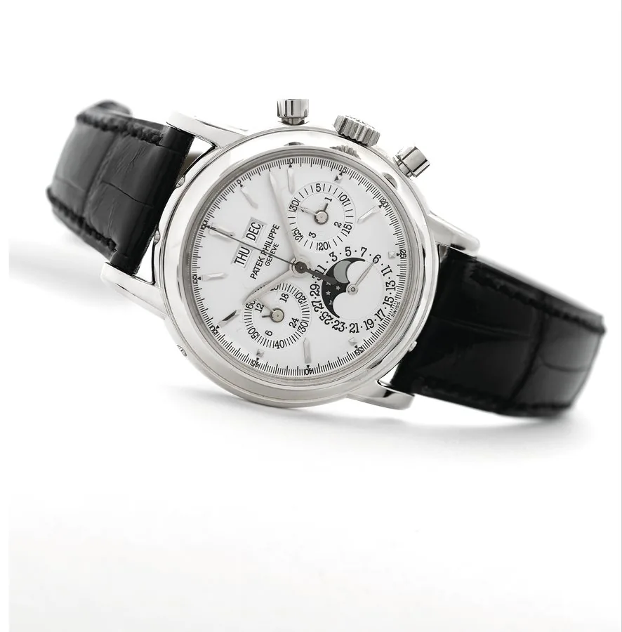 White Gold Ref. 3970EG Patek Philippe, Genève, Ref. 3970EG. Made in 2003. Very fine and important, water-resistant, 18K white gold wristwatch with round button chronograph, register, perpetual calendar, moon phases, leap year, 24-hour indication and an 18K white gold Patek Philippe deployant clasp. Accompanied by the original fitted box, Certificate of Origin, setting pin, booklet and additional 18K solid white gold case back.