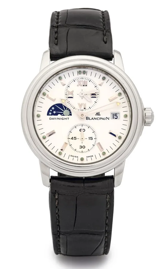 BLANCPAIN TIME ZONE DAY/NIGHT STEEL Blancpain, "Time Zone, Day/Night," No. 107. Made circa 2001. Fine, self-winding, water-resistant, two time zone, stainless steel wristwatch with day/night indication, date and a stainless steel Blancpain deployant clasp.