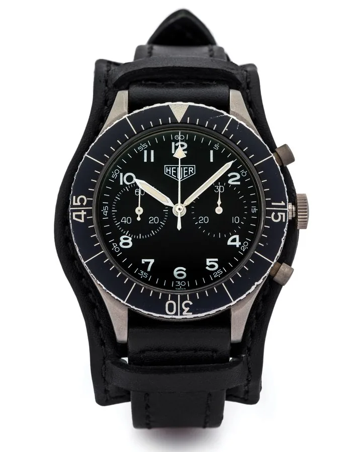 HEUER REF. 1550SG BUNDESWEHR STEEL Heuer, "Bundeswehr.", No. 337838, Ref. 1550SG. Made for the German Military in 1976. Fine, water-resistant, stainless steel military wristwatch with black bezel, round button Flyback chronograph and register.