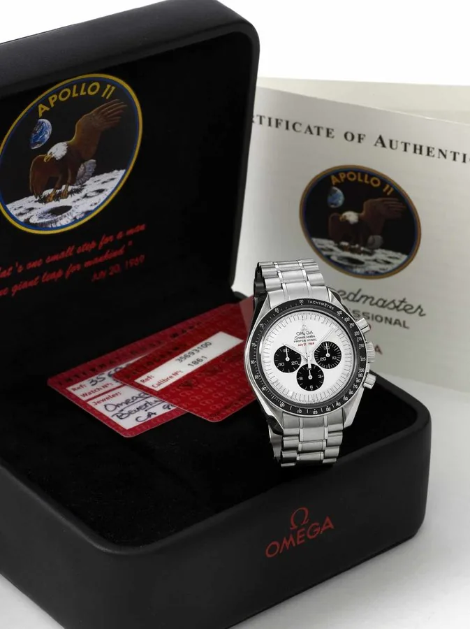 Omega Apollo 11 ' 35th Anniversary Omega, 'Speedmaster Professional - Apollo 11 Limited Edition' No. 2042/3500, No. 77136823, Ref. 35693100. Made in a limited edition of 3500 pieces in 2004 to commemorate the 35th Anniversary of Apollo 11, 1969 - 2004. Fine and rare, water-resistant, stainless steel wristwatch with round button chronograph, registers, black bezel with tachometer graduation to 500 UPH and a stainless steel Omega link bracelet. Accompanied by the original fitted box, Warranty (now