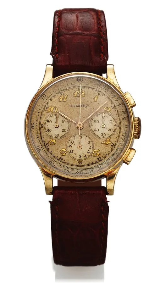 MOVADO REF. 49020 RETAILED BY TIFFANY & CO. Movado retailed by Tiffany & Co. Case No. 99210, Ref. 49020. Made in the 1940's. Fine, 14K yellow gold wristwatch with square button chronograph, registers and tachometer.