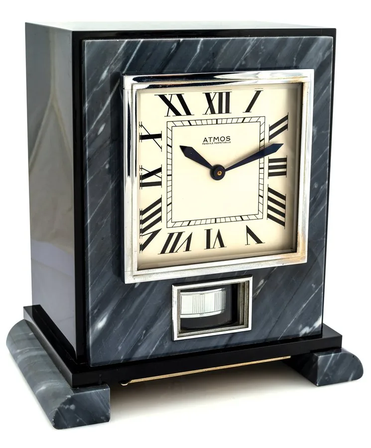 J. L. REUTTER PATENT ATMOS TWO COLOR MARBLE Atmos, "Pendule Perpetuelle", J.L. Reutter patent, No. 4144, Swiss. Made in the late 1920s. Very fine and very rare, early, Art Deco, black and gray marble "perpetual" clock wound by changes in barometric pressure with early mercury in glass expansion device.