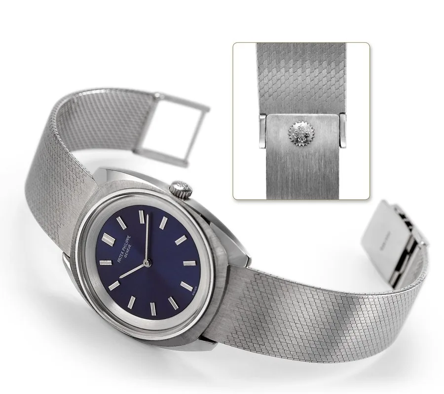 PATEK PHILIPPE REF. 3579 STAINLESS STEEL Patek Philippe, Genève, movement No. 1213038, case No. 524187, Ref. 3579. Japan limited edition made in 1974. Very fine and rare, tonneau-shaped, water resistant, stainless steel wristwatch with an 18K white gold Patek Philippe Japan bracelet. To be sold without reserve