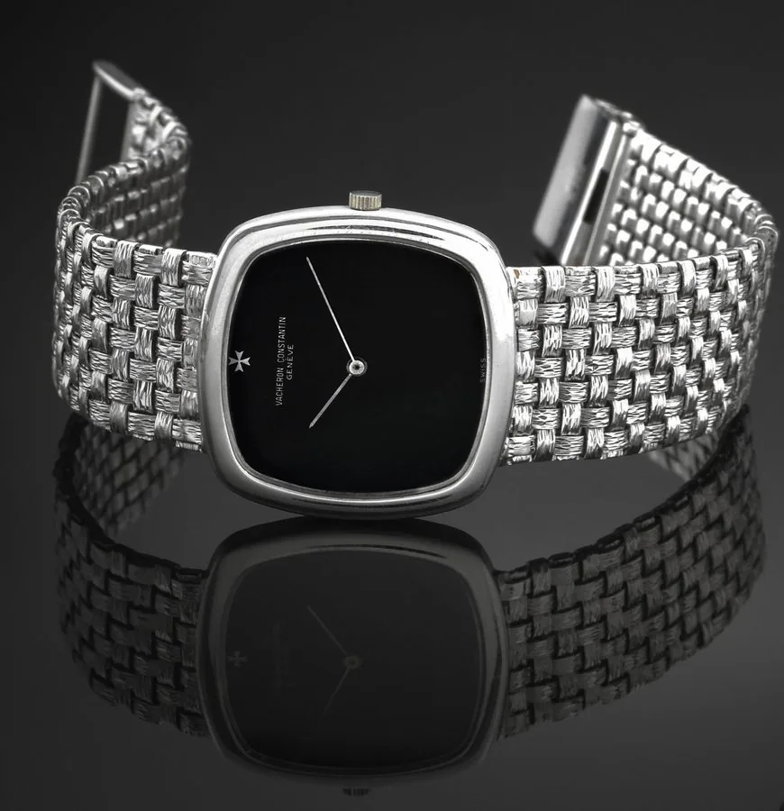 VACHERON CONSTANTIN REF. 2098 WHITE GOLD, ONYX DIAL Vacheron & Constantin, Genève, No. 661312, case No. 497852, Ref. 2098. Made in the 1970s. Very fine and elegant, thin, cushion-shaped, 18K white gold wristwatch with an integral 18K white gold woven textured bracelet.
