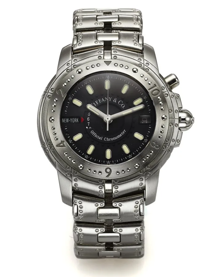 TIFFANY & CO. REF. M141, "STREAMERICA" AUTOMATIC Tiffany & Co., Streamerica, Automatic, case No. 26-074, Ref. M141. Made circa 2010. Fine, water-resistant, center seconds, self-winding, stainless steel Chronometer wristwatch with date, 24-hour world time indicator and a stainless steel Tiffany & Co. link bracelet with double deployant clasp.