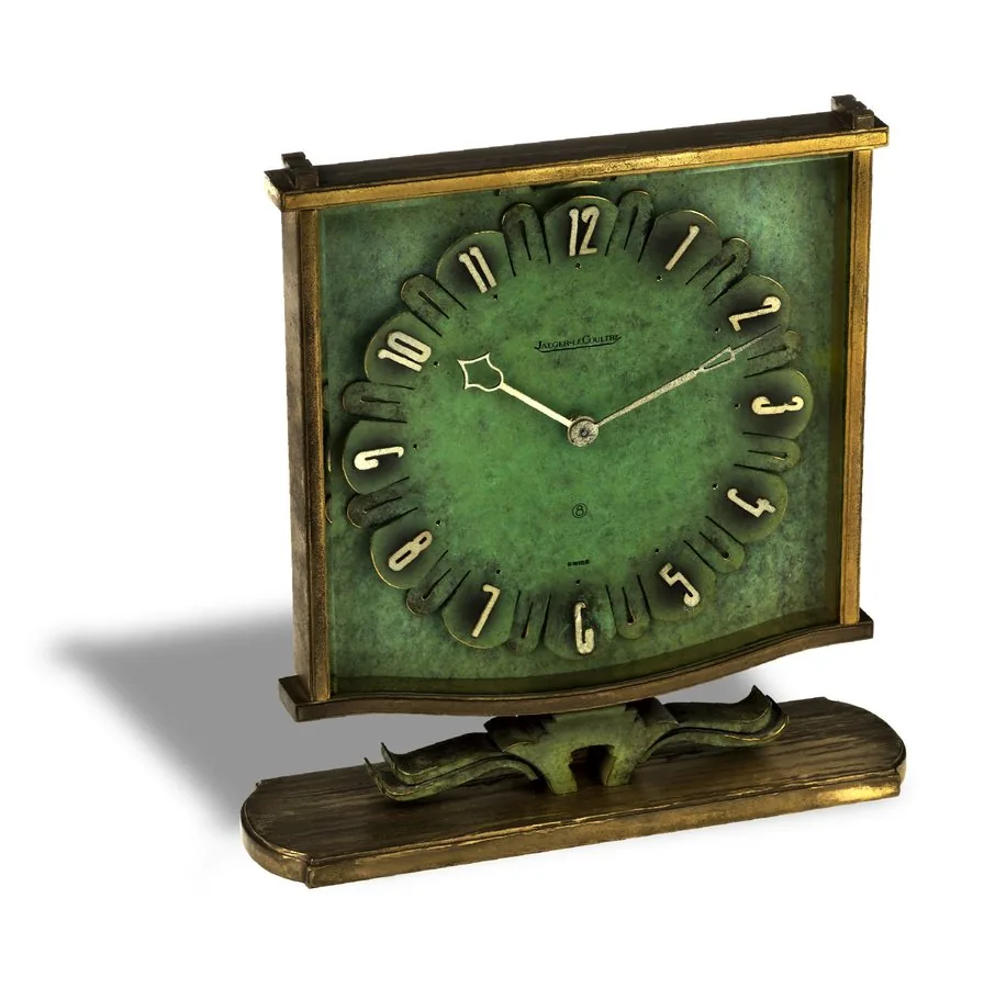 JAEGER-LECOULTRE PENDULETTE LA FLEUR Jaeger-LeCoultre, Ref. 273. Made circa 1955. Fine and rare, 8-day going, gilt brass and painted metal mantel clock. To be sold without reserve