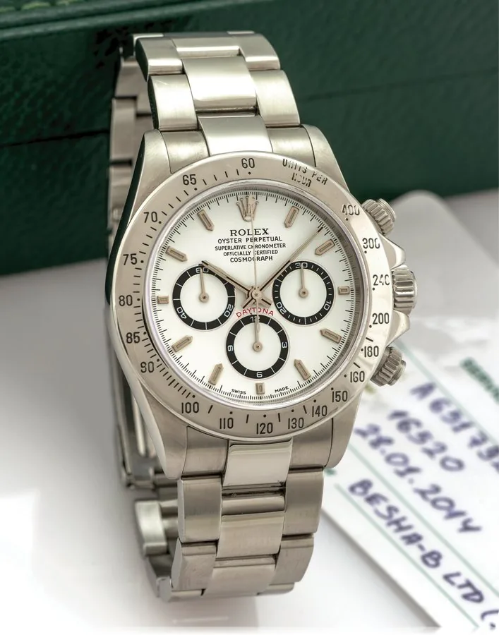 ROLEX REF. 16520 ZENITH DAYTONA Rolex, Oyster Perpetual, Superlative Chronometer, Officially Certified Cosmograph Daytona, case No. A 651792, Ref. 16520. Made in 1999. Fine, self-winding, water resistant to 100 m, stainless steel wristwatch with round button chronograph, registers, tachometer and a stainless steel Rolex Oyster bracelet Ref. 78390. Accompanied by a Rolex service warranty dated 2014 and a Rolex fitted box.