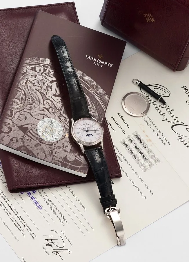 PATEK PHILIPPE REF.5050 ROMAN DIAL WHITE GOLD Patek Philippe, Genève, No. 1957963, case No. 2998632, Ref. 5050G. Very fine and very rare, astronomic, center seconds, self-winding, water resistant 18K white gold wristwatch with perpetual calendar, retrograde date, leap year indication, moon phases and an 18K white gold Patek Philippe deployant clasp. Accompanied by the original fitted winding box, Certificate of Origin, additional 18K white gold case back, push pin and instruction booklet.