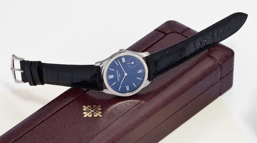 PATEK PHILIPPE REF. 5026G CALATRAVA WHITE GOLD Patek Philippe, Genève, Calatrava, No. 3151440, case No. 4074011, Ref. 5026G. Made circa 2000. Very fine and rare, self-winding, water-resistant, 18K white gold wristwatch with an 18K white gold Patek Philippe buckle. Accompanied by original Patek Philippe box, booklets, folder and certificate.