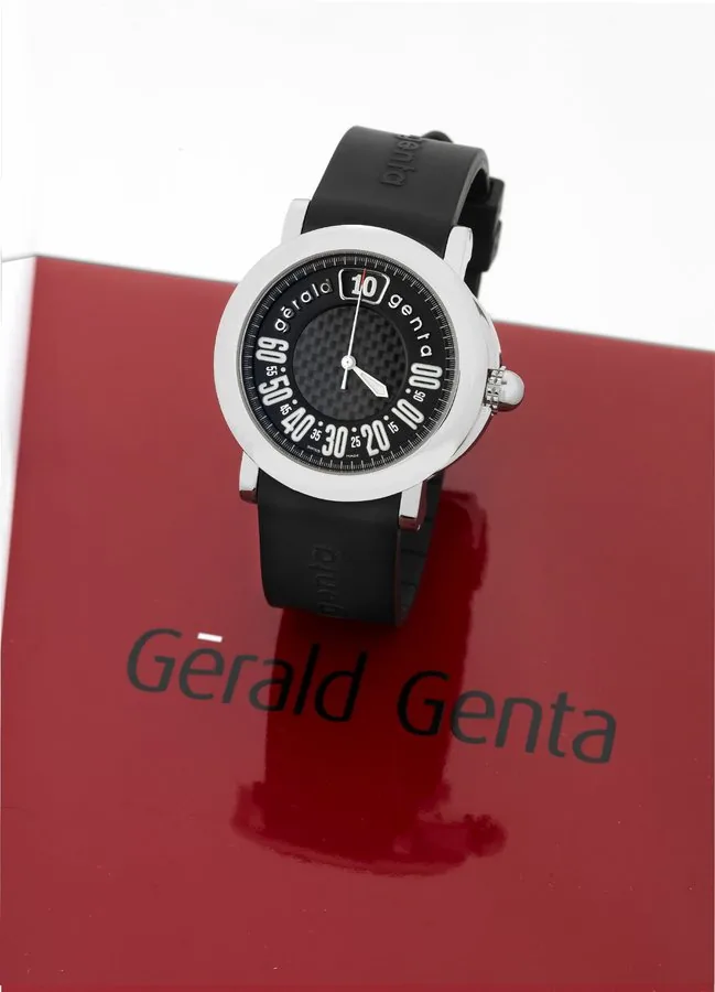 Gerald Genta Steel Retro Sport Gérald Genta, 'Retro Sport', case No. 110422, Ref. RSP.L.10. Made in the late 1990s. Fine, jump-hour, center-seconds, self-winding, water-resistant, stainless steel wristwatch with retrograde minutes and a black rubber strap with a stainless steel Gérald Genta buckle. Accompanied by a fitted box.