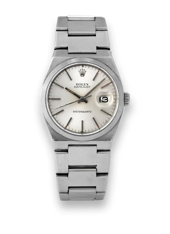 ROLEX REF. 17000B, OYSTERQUARTZ STEEL Rolex, Genève, Datejust, Oysterquartz, case No. 6010469, Ref. 17000. Made in 1979. Production of this reference ceased circa 1995. Fine, tonneau-shaped, center seconds, water-resistant, stainless steel chronometer quartz wristwatch with date and an integral stainless steel Rolex Oyster bracelet with deployant clasp.