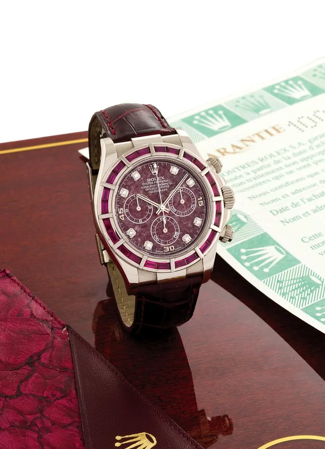 ROLEX, REF. 116589, DAYTONA, BAGUETTE RUBY WHITE GOLD Rolex, "Oyster Perpetual, Superlative Chronometer Officially Certified, Cosmograph, Daytona", case No. P193705, Ref. 116589. Sold in September 2002. Very fine, self-winding, water-resistant, 18K white gold and diamond Chronometer wristwatch, with round button chronograph, baguette-diamonds set bezel, 12 hour and 30 minute registers and an 18K white gold Rolex deployant clasp. Accompanied by fitted box and guarantee.