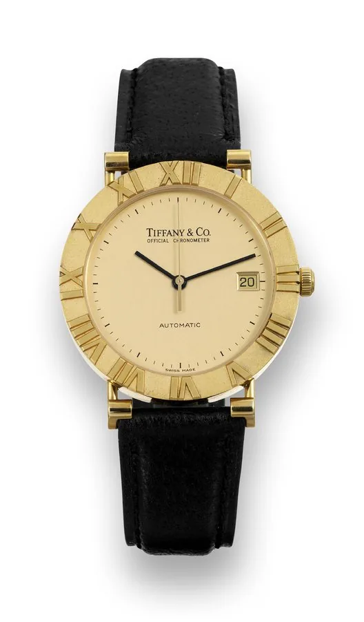 Tiffany & Co. Atlas Tiffany & Co., Atlas, 'Official Chronometer, Automatic', case No. M6930, Ref. 41-029. Made circa 2000. Fine, water-resistant, center seconds, self-winding, 18K yellow gold chronometer wristwatch with date and a gold plated Tiffany & Co buckle. To be sold without reserve