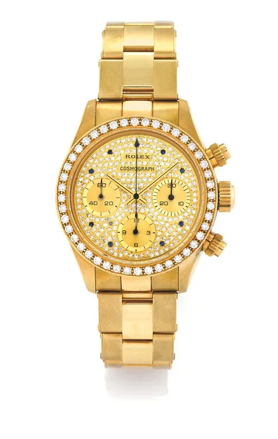 ROLEX REF. 6269/8 DIAMOND COSMOGRAPH OMAN Rolex, Cosmograph, Oyster, Superlative Chronometer, Officially Certified, No. 8397326, Ref. 6269/6263. Sold to Oman in 1985. Fine, possibly unique and extremely rare, water-resistant, 18K yellow gold gentleman's wristwatch with round button chronograph, registers, bezel set with 44 diamonds, dial set with 240 diamonds and nine sapphires, and an 18K yellow gold Rolex Ref. 7205 riveted bracelet.