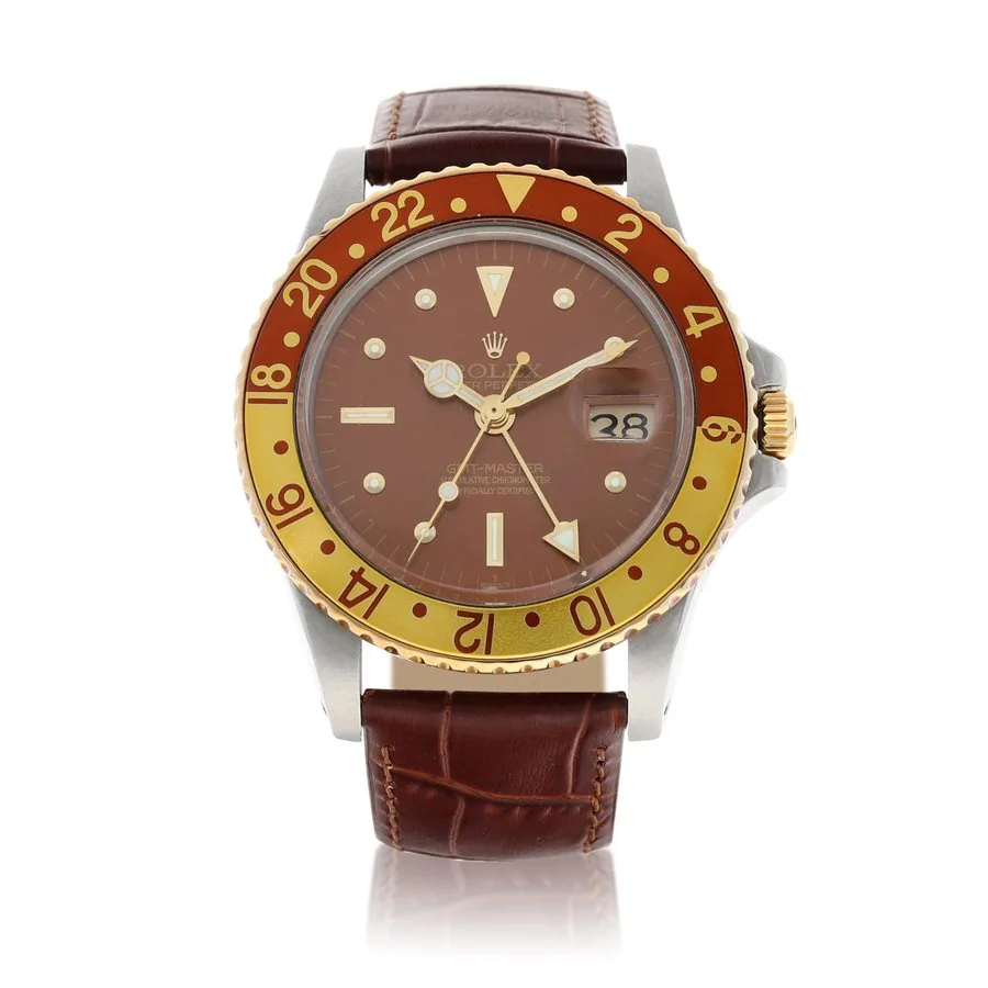 Rolex Rolex | GMT-Master "Rootbeer", Reference 1675, A yellow gold and stainless steel dual time zone wristwatch with date, Circa 1972 | 勞力士 | GMT-Master "Rootbeer" 型號1675   黃金及精鋼兩地時間鏈帶腕錶，備日期顯示，約1972年製 · 1675