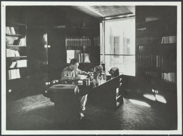 Emperor Bao Dai photographed working at his desk