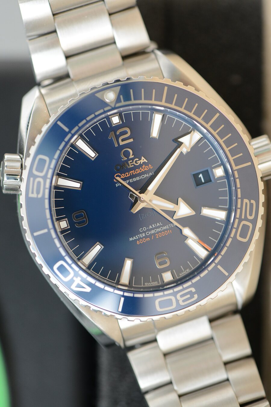An Omega Seamaster with Co-Axial printed on the dial