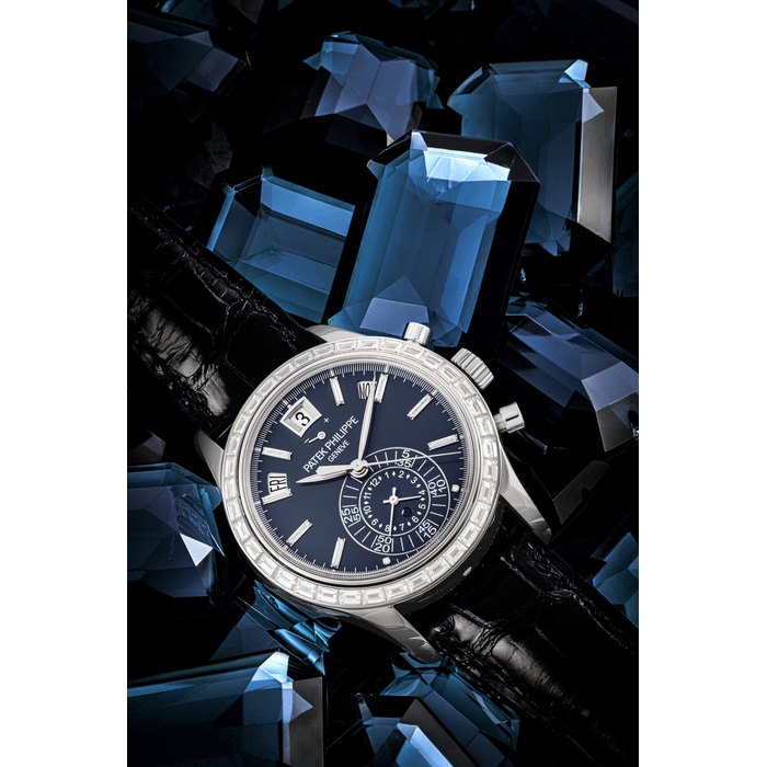 PATEK PHILIPPE. A PLATINUM AND BAGUETTE-CUT DIAMOND-SET AUTOMATIC ANNUAL CALENDAR FLYBACK CHRONOGRAPH WRISTWATCH WITH POWER RESERVE AND DAY/NIGHT INDICATION REF. 5961P-001, MOVEMENT NO. 5’775’772, CASE NO. 4’672’951, CIRCA 2015