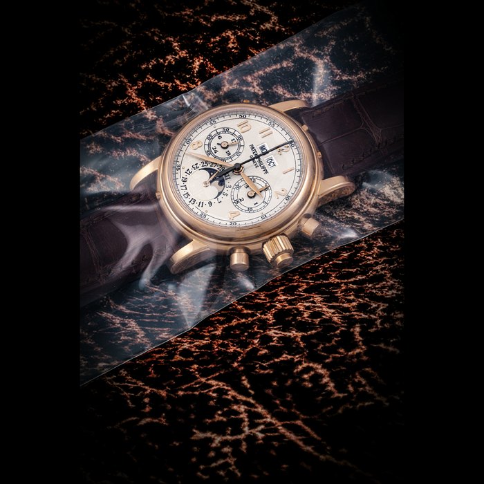 Patek Philippe PATEK PHILIPPE. A RARE 18K PINK GOLD PERPETUAL CALENDAR SPLIT SECONDS CHRONOGRAPH WRISTWATCH WITH MOON PHASES, 24 HOUR AND LEAP YEAR INDICATION, SINGLE SEALED REF. 5004R-014, MOVEMENT NO. 3’275’142, CASE NO. 4’438’217, CIRCA 2007, Price & Market Data
