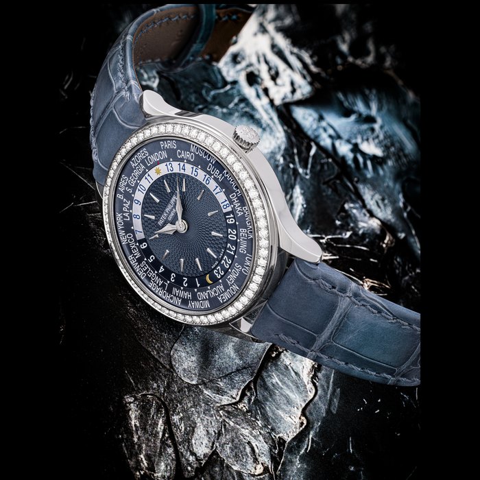 PATEK PHILIPPE. A LADY’S ATTRACTIVE 18K WHITE GOLD AND DIAMOND-SET AUTOMATIC WORLD TIME WRISTWATCH REF.7130G-016, MOVEMENT NO. 7’499’557, CASE NO. 6’529’344, CIRCA 2022