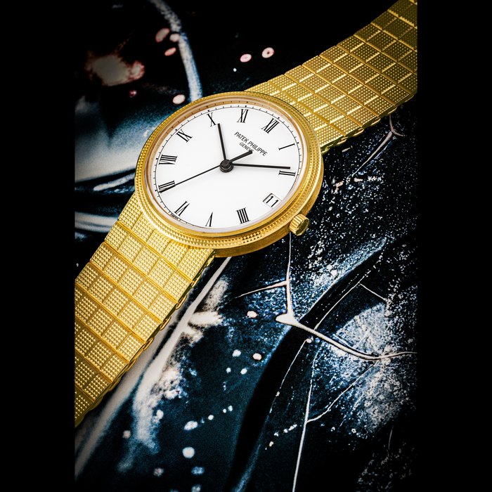 PATEK PHILIPPE. AN 18K GOLD AUTOMATIC BRACELET WATCH WITH SWEEP CENTRE SECONDS AND DATE REF. 3802⁄110, MOVEMENT NO. 1’441’114, CASE NO. 2’832’983, MANUFACTURED IN 1987