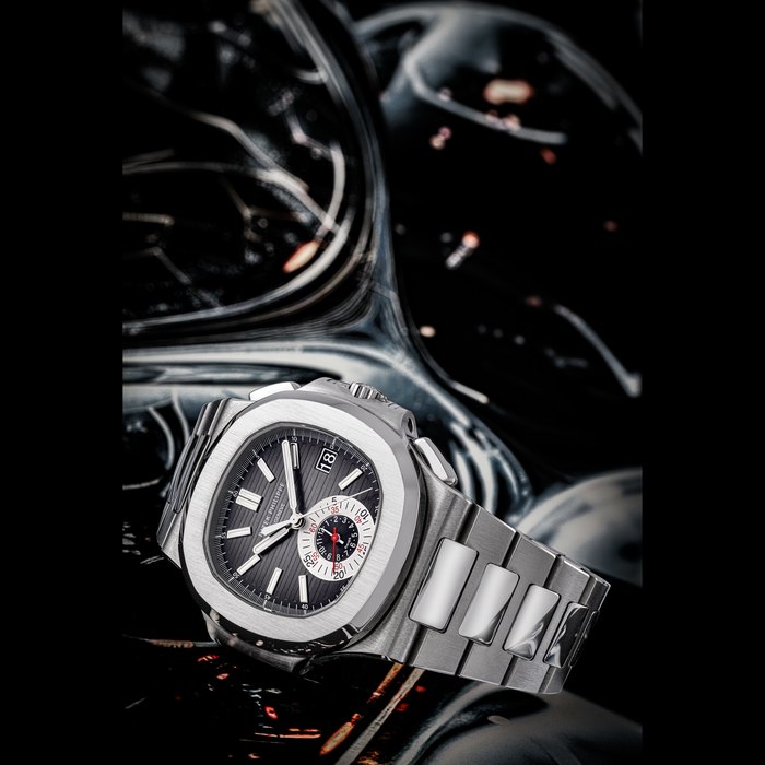 PATEK PHILIPPE. AN ATTRACTIVE STAINLESS STEEL AUTOMATIC FLYBACK CHRONOGRAPH WRISTWATCH WITH DATE AND BRACELET NAUTILUS MODEL, REF. 5980/1A-014, MOVEMENT NO. 5’659’645, CASE NO. 4’564’571, CIRCA 2012