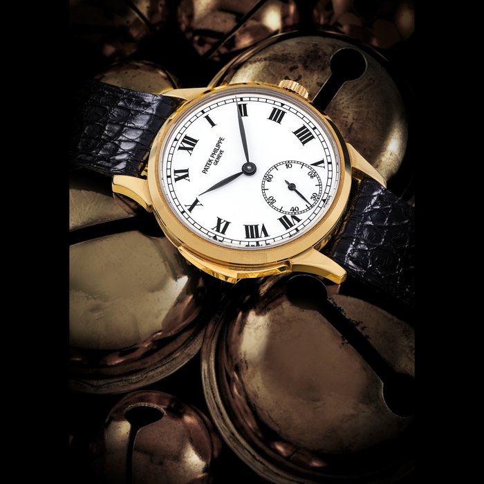 PATEK PHILIPPE. AN EXTREMELY RARE AND ATTRACTIVE 18K GOLD AUTOMATIC MINUTE REPEATING WRISTWATCH WITH CASE MADE BY JEAN-PIERRE HAGMANN, MADE TO CELEBRATE THE 150TH ANNIVERSARY OF PATEK PHILIPPE IN 1989 REF. 3979J, MOVEMENT NO. 1’904’027, CASE NO. 2’067’144, CIRCA 1991