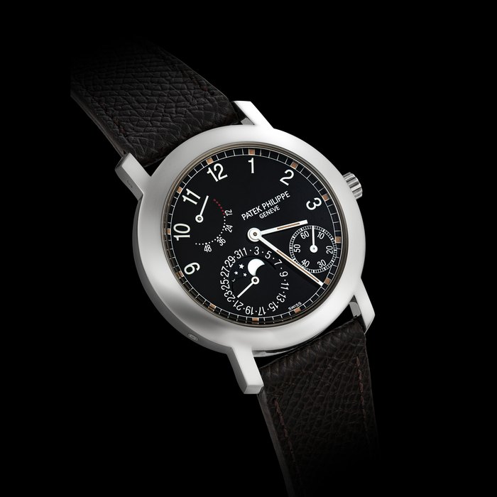 PATEK PHILIPPE. AN 18K WHITE GOLD AUTOMATIC WRISTWATCH WITH DATE, MOON PHASES AND POWER RESERVE REF. 5055G-001, MOVEMENT NO. 3’109’363, CASE NO. 4’023’399, CIRCA 1998