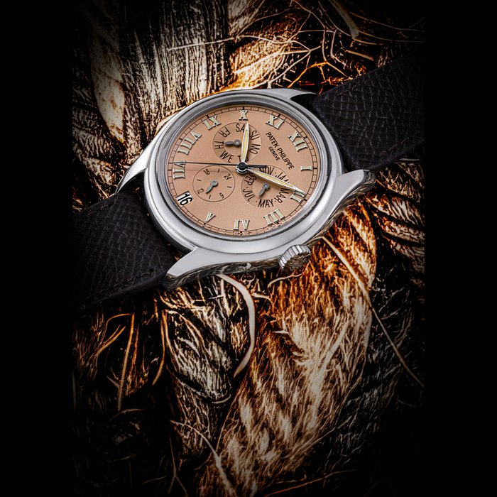 PATEK PHILIPPE. AN 18K WHITE GOLD AUTOMATIC ANNUAL CALENDAR WRISTWATCH WITH SWEEP CENTRE SECONDS AND 24 HOUR INDICATION REF. 5035G, MOVEMENT NO. 3’056’141, CASE NO. 4’009’093, CIRCA 1997