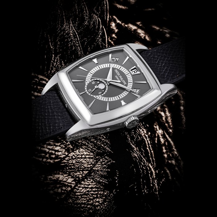 PATEK PHILIPPE. A PLATINUM AND DIAMOND-SET AUTOMATIC ANNUAL CALENDAR WRISTWATCH WITH SWEEP CENTRE SECONDS, 24 HOUR INDICATION AND MOON PHASES REF. 5135P-001, MOVEMENT NO. 3’921’420, CASE NO. 4’462’514, CIRCA 2009