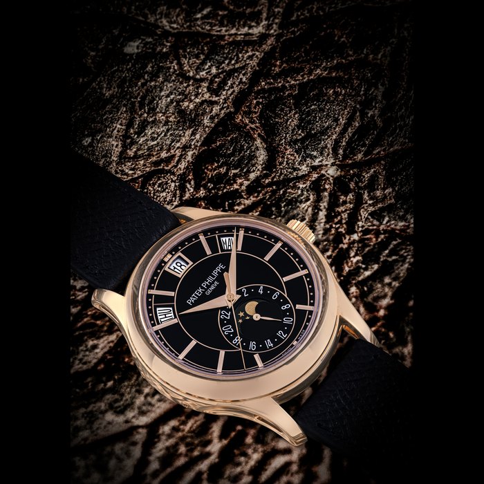 PATEK PHILIPPE. AN 18K PINK GOLD AUTOMATIC ANNUAL CALENDAR WRISTWATCH WITH SWEEP CENTRE SECONDS, MOON PHASES AND 24 HOUR INDICATION REF. 5205R-010, MOVEMENT NO. 7’116’642, CASE NO. 6’216’198, CIRCA 2019