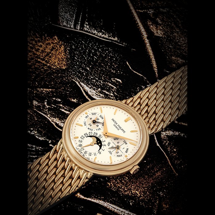 PATEK PHILIPPE. AN 18K PINK GOLD AUTOMATIC PERPETUAL CALENDAR BRACELET WATCH WITH MOON PHASES, LEAP YEAR AND 24 HOUR INDICATIONS REF. 3945/001R, MOVEMENT NO. 772’258, CASE NO. 2’867’002, CIRCA 1991