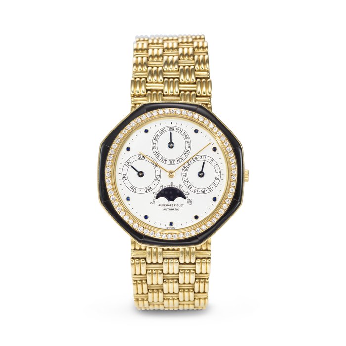 AUDEMARS PIGUET. A VERY RARE AND HIGHLY ATTRACTIVE 18K GOLD, ONYX AND DIAMOND-SET AUTOMATIC PERPETUAL CALENDAR WRISTWATCH WITH MOON PHASES AND BRACELET SIGNED AUDEMARS PIGUET, QUANTIEME PERPETUEL MODEL, REF. 5551BA, MOVEMENT NO. 225'472, CASE NO. B 56116, NO. 350, SOLD IN 1981