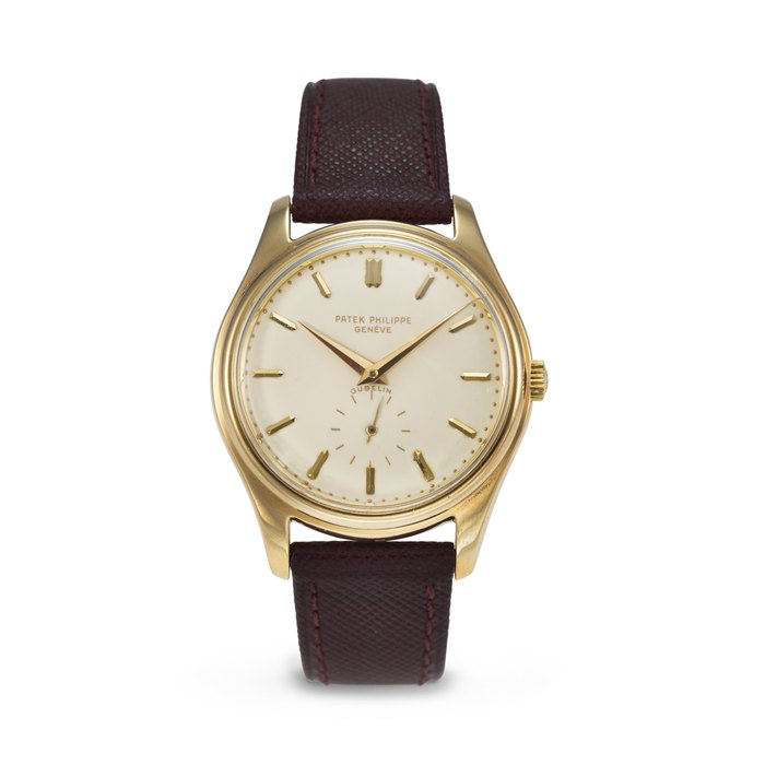 PATEK PHILIPPE. A VERY RARE AND ELEGANT 18K GOLD AUTOMATIC WRISTWATCH WITH CREAM-COLOURED ENAMEL DIAL SIGNED PATEK PHILIPPE, RETAILED BY GÜBELIN, REF. 2526, MOVEMENT NO. 761'120, CASE NO. 683'702, MANUFACTURED IN 1954