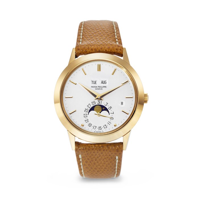 PATEK PHILIPPE. A RARE AND ELEGANT 18K GOLD AUTOMATIC PERPETUAL CALENDAR WRISTWATCH WITH MOON PHASES AND LEAP YEAR INDICATION SIGNED PATEK PHILIPPE, REF. 3450, MOVEMENT NO. 1'119'771, CASE NO. 2'808'547, MANUFACTURED IN 1985