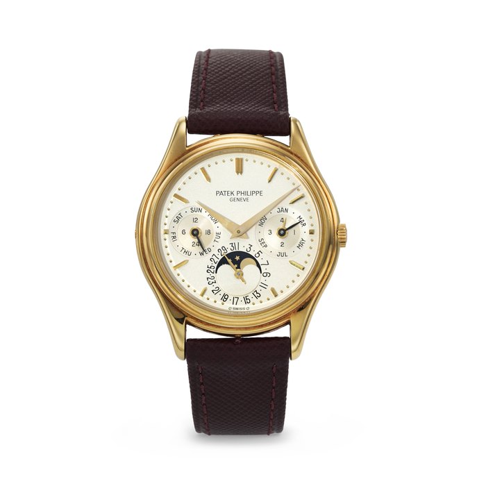PATEK PHILIPPE. A RARE AND ELEGANT 18K GOLD AUTOMATIC PERPETUAL CALENDAR WRISTWATCH WITH MOON PHASES, 24-HOUR, AND LEAP YEAR INDICATION SIGNED PATEK PHILIPPE, REF. 3940, MOVEMENT NO. 771'290, CASE NO. 2'852'897, CIRCA 1988