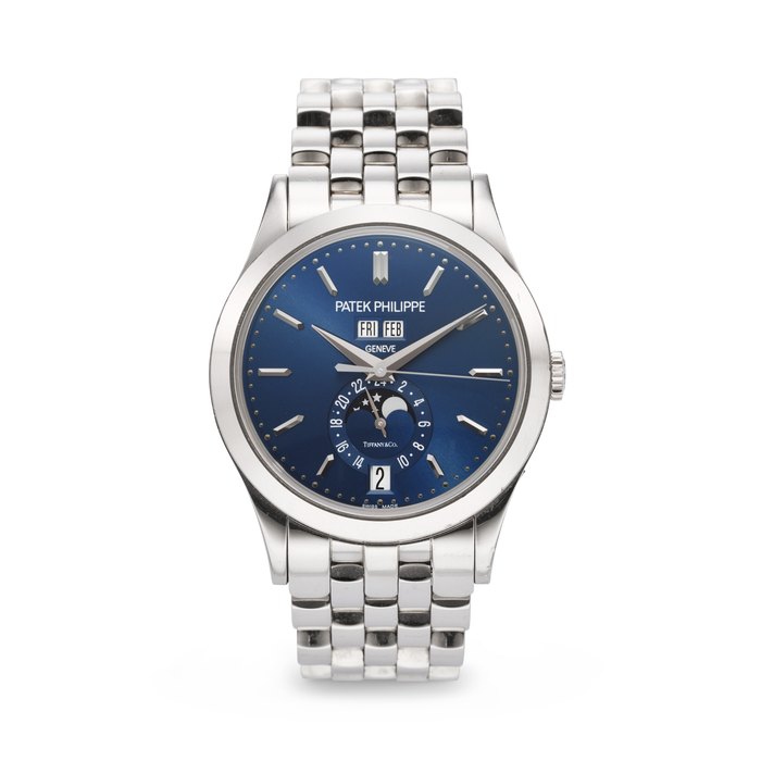 PATEK PHILIPPE. A VERY RARE AND ELEGANT 18K WHITE GOLD AUTOMATIC ANNUAL CALENDAR WRISTWATCH WITH SWEEP CENTER SECONDS, MOON PHASES, 24-HOUR INDICATION, AND BRACELET SIGNED PATEK PHILIPPE, RETAILED BY TIFFANY & CO., REF. 5396/1G-001, MOVEMENT NO. 5'772'177, CASE NO. 4'640'255, CIRCA 2014