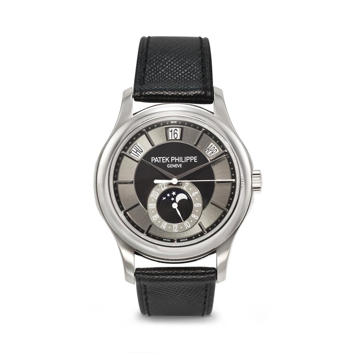 PATEK PHILIPPE. AN ATTRACTIVE 18K WHITE GOLD AUTOMATIC ANNUAL CALENDAR WRISTWATCH WITH SWEEP CENTER SECONDS, MOON PHASES, AND 24-HOUR INDICATION SIGNED PATEK PHILIPPE, REF. 5205G-010, MOVEMENT NO. 5'629'981, CASE NO. 4'545'187, CIRCA 2013
