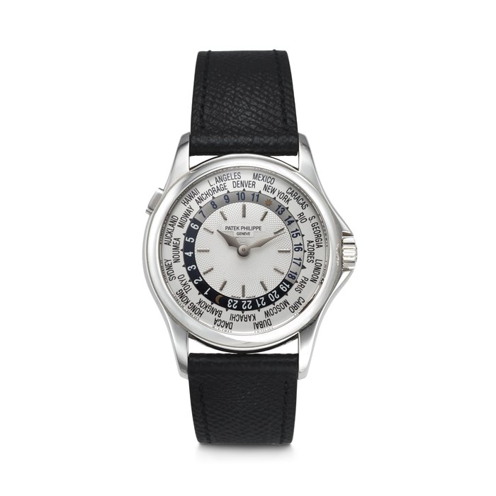 PATEK PHILIPPE. AN ATTRACTIVE 18K WHITE GOLD AUTOMATIC WORLD TIME WRISTWATCH SIGNED PATEK PHILIPPE, WORLD TIME MODEL, REF. 5110G-001, MOVEMENT NO. 3'208'449, CASE NO. 4'155'927, CIRCA 2003