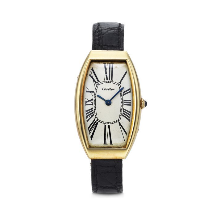 Cartier CARTIER. AN EXTREMELY RARE, UNUSUAL AND ELONGATED 18K GOLD TONNEAU-SHAPED WRISTWATCH SIGNED CARTIER, LONDON, TONNEAU MODEL, CASE AND CLASP NO. 1263, MOVEMENT SIGNED JAEGER-LECOULTRE, CASE AND CLASP WITH MATCHING LONDON HALLMARKS FOR 1972