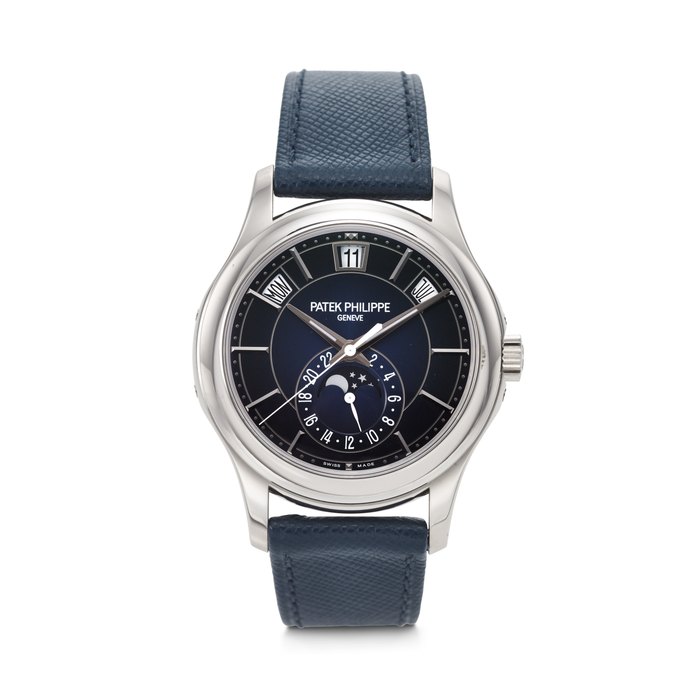PATEK PHILIPPE. AN ATTRACTIVE 18K WHITE GOLD AUTOMATIC ANNUAL CALENDAR WRISTWATCH WITH SWEEP CENTRE SECONDS, MOON PHASES AND 24-HOUR INDICATION SIGNED PATEK PHILIPPE, REF. 5205G-013, MOVEMENT NO. 7'306'560, CASE NO. 6'380'204, CIRCA 2020