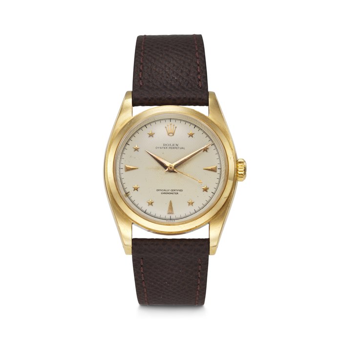 ROLEX. AN EXCEEDINGLY RARE AND HIGHLY ATTRACTIVE 18K GOLD AUTOMATIC WRISTWATCH WITH SWEEP CENTRE SECONDS AND LUMINOUS HONEYCOMB STAR DIAL SIGNED ROLEX, OYSTER PERPETUAL, REF. 6098, CASE NO. 947'830, CIRCA 1953