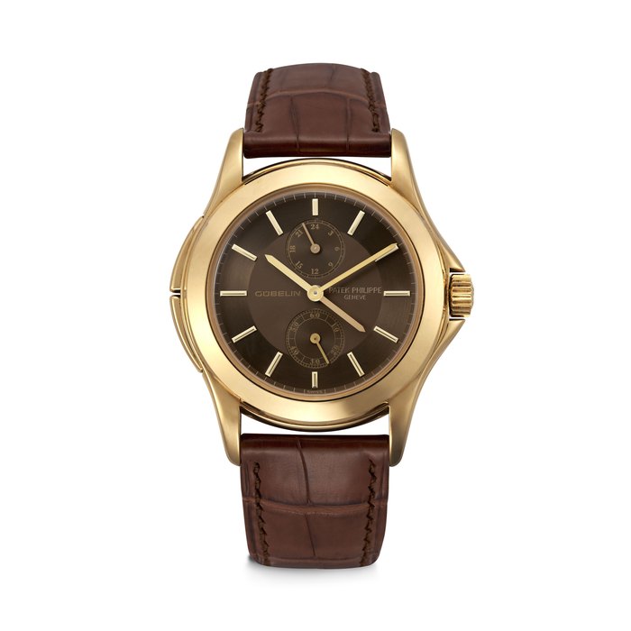 PATEK PHILIPPE. AN EXTREMELY RARE 18K GOLD LIMITED EDITION DUAL TIME WRISTWATCH WITH 24 HOUR INDICATION, MADE FOR THE 150 TH ANNIVERSARY OF GÜBELIN CALATRAVA TRAVEL TIME MODEL, REF. 5134J-010, MOVEMENT NO. 3’087’004, CASE NO. 4’224’722, CIRCA 2005